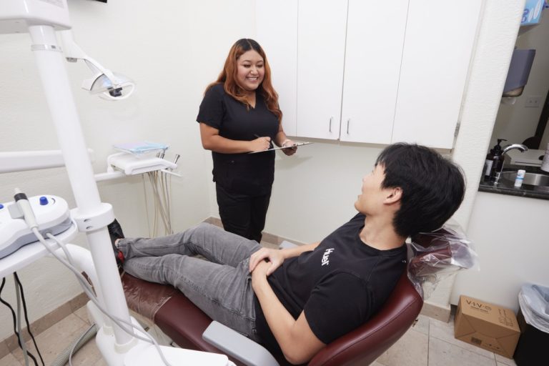 Clinic staff helping patient 1